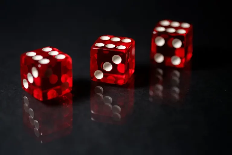Red Sic Bo Dice on a black background